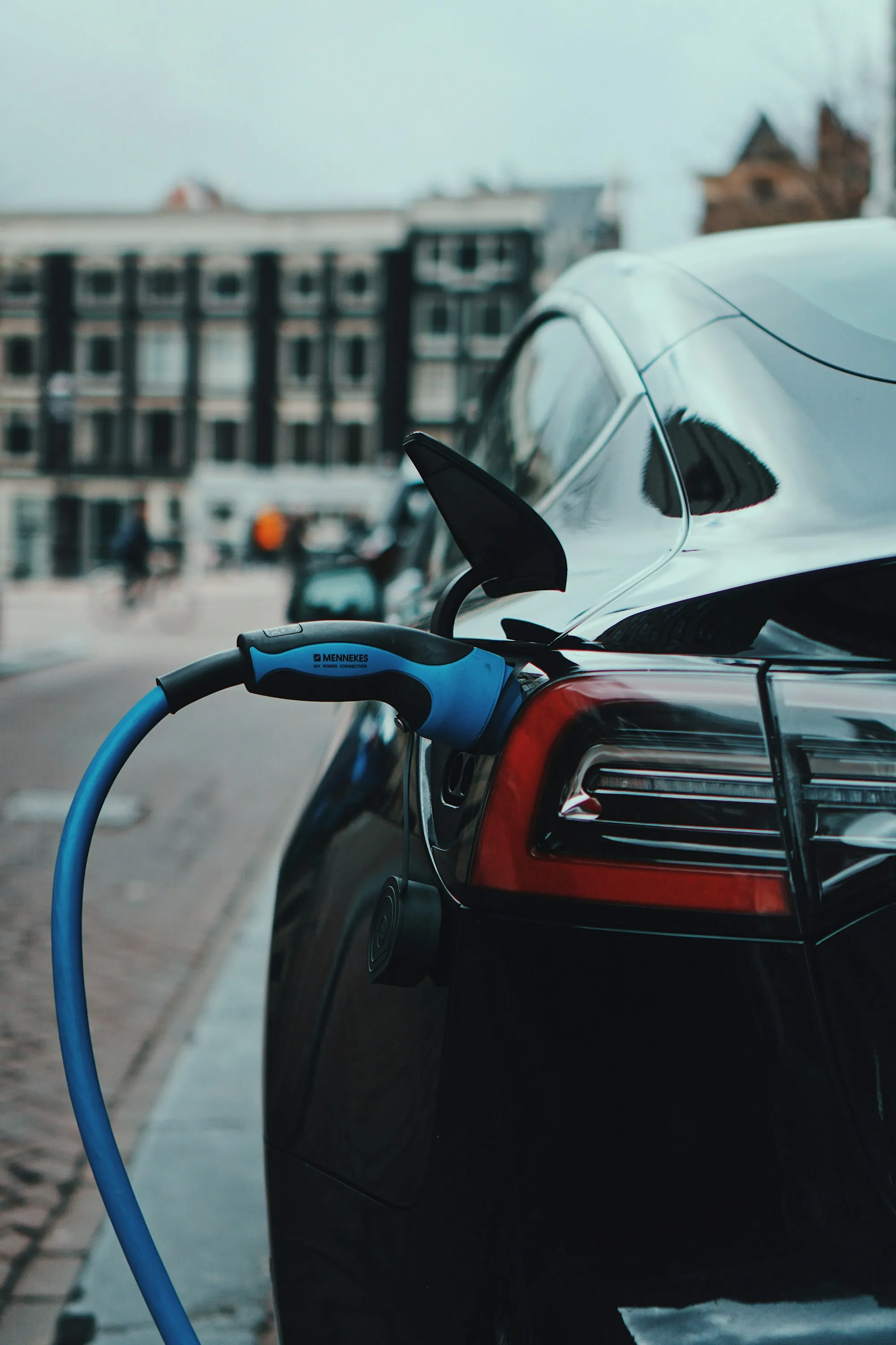 Electric car plugged in to a charging cable